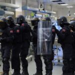 UK police in Swat gear raiding a baby maternity ward in England.