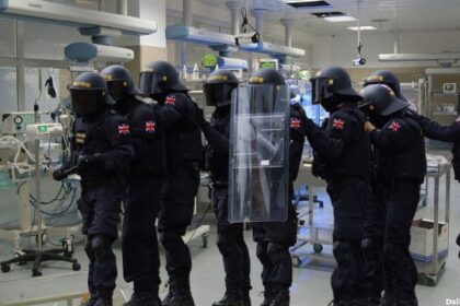 UK police in Swat gear raiding a baby maternity ward in England.