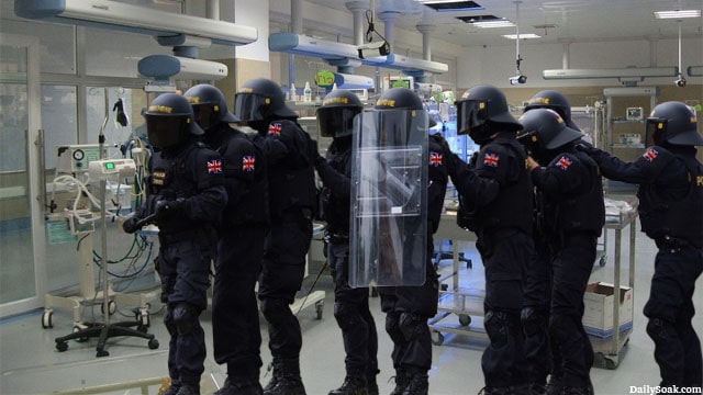 UK police in Swat gear raiding a baby maternity ward in England.