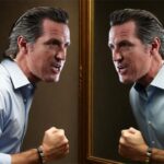 California Governor Gavin Newsom inside bathroom yelling into mirror.