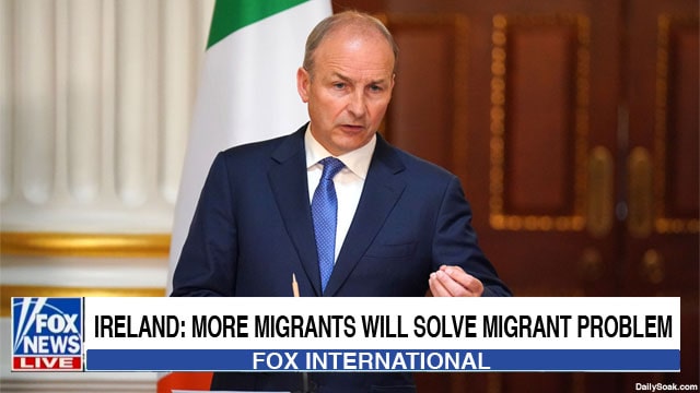 Ireland Prime Minister giving a speech on stage about migrant crisis.