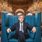Canada Prime Minister Mark Carney sitting on a chair inside of his office.