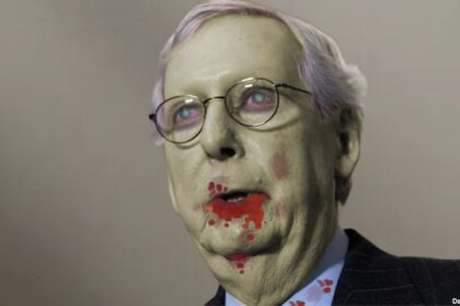 Congress Senator Mitch McConnell with blood dripping from his mouth dressed as a zombie for Halloween.