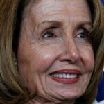 Nancy Pelosi closeup smiling painfully due to all the Botox hiding the wrinkles.