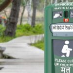 Dog poop waste station for immigrants in Canada park.