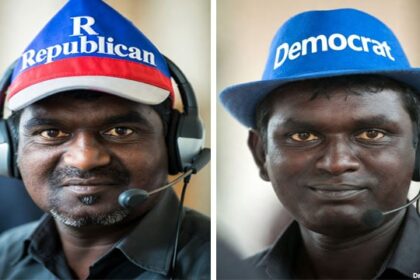 Indian troll farm Indian male scammers wearing GOP Republican and DNC Democrat hats inside call center.