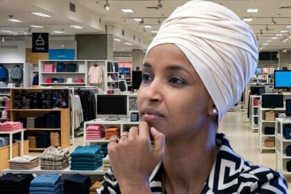 Ilhan Omar wearing a hijab inside of a department store looking for gifts for brother.