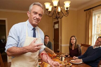 HHS Secretary RFK Jr. holding a syringe in front of a Thanksgiving turkey on a table.