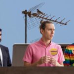 Zohran Mamdani on a rooftop with two of his white make gay supporters.