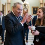 Chuck Schumer talking to a female staffer in Congress on Christmas.