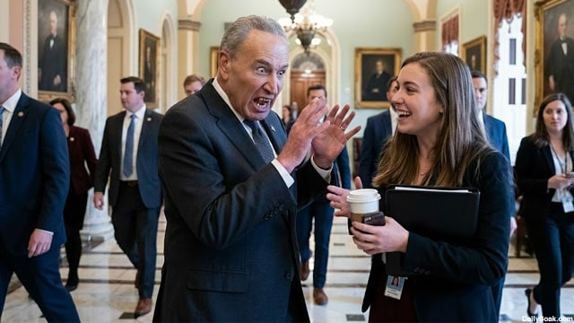 Chuck Schumer talking to a female staffer in Congress on Christmas.