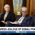 Congress members sitting in a room discussing Somali fraud.