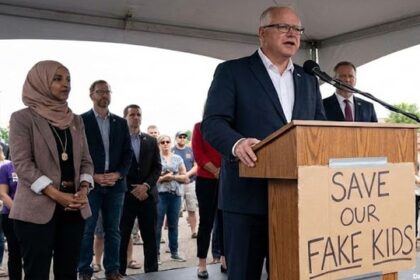 Democrats Tim Walz and Ilhan Omar on stage speaking behind a podium in Minnesota on Somali daycare fraud.