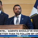 FBI Director Kash Patel behind a podium giving a speech.