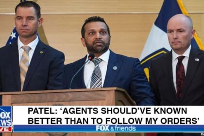 FBI Director Kash Patel behind a podium giving a speech.
