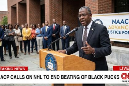 NAACP black man behind podium giving speech on NHL.