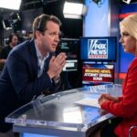 Fox News producer pleading with Pam Bondi dressed in red jacket sitting down in a studio.