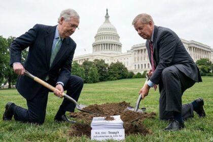 Republicans in Congress in front of the Capitol Building burying Trump's agenda bill.