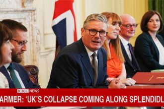 UK government Prime Minister Keir Starmer sitting at a table with numerous female and male British leaders.