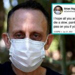 COVID Vaccinated man wearing a medical mask angry at the unvaccinated.