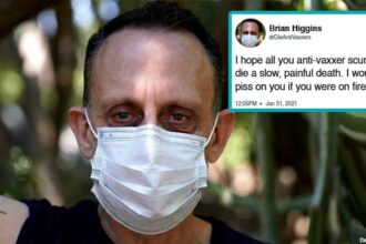 COVID Vaccinated man wearing a medical mask angry at the unvaccinated.
