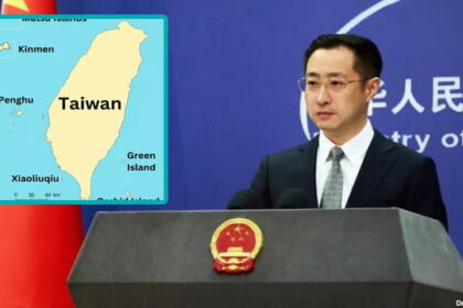 China foreign male minister on stage speaking on President Trump buying Greenland.