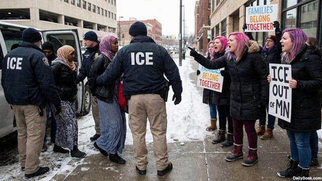 ICE agents arresting Somalis in Minnesota as white female protesters scream at them.