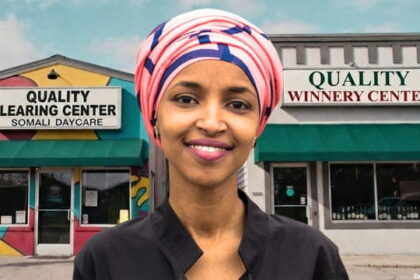 Black female Congresswoman Ilhan Omar standing in front of Somali daycare center.