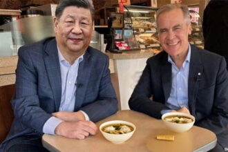 Mark Carney and Xi Jinping in China Chinese restaurant.