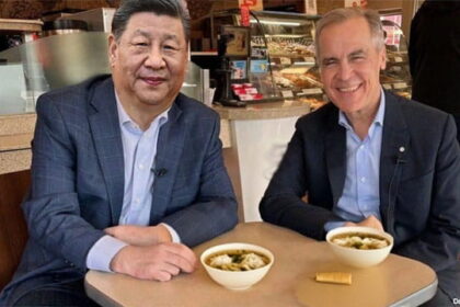 Mark Carney and Xi Jinping in China Chinese restaurant.