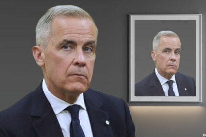 Prime Minister Mark Carney standing in front of a picture frame of himself.