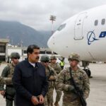 Venezuela dictator Nicolás Maduro in handcuffs surrounded by US military standing in front of a Boeing plane.