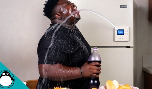 Fat black man with water being shot at his face by an RFK Jr. smart refrigerator.