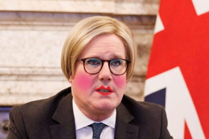 UK Prime Minister Keir Starmer wearing women's makeup and a blonde wig.