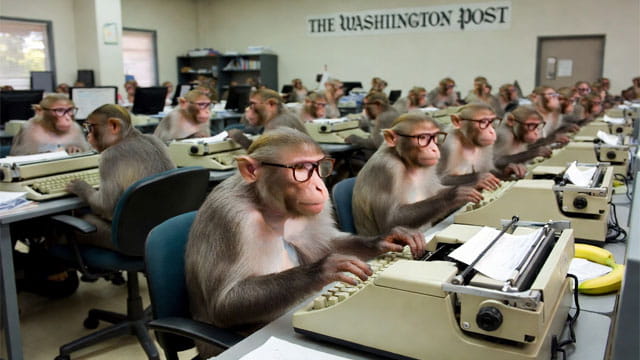 Monkeys working at desks at The Washington Post office.