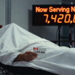 Canadian man lying on a gurney under a white sheet inside of a Canada hospital emergency room.