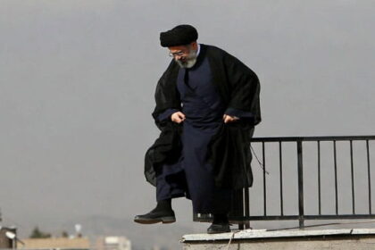 Iran Ayatollah wearing Islamic clothing standing on a rooftop in Iran.
