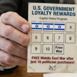 A man holding a US government loyalty rewards card with Israel flags on it.