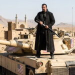 Steven Seagal standing on top of a US tank in an Iran desert during President Trump's Iran war.
