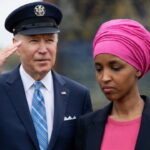 Joe Biden saluting Ilhan Omar outside during a speech.