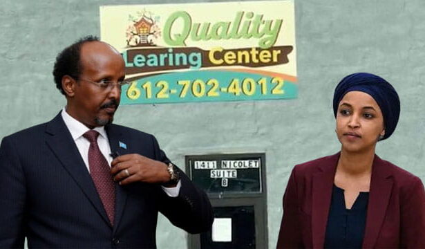 Ilhan Omar wearing Islamic clothing standing next to Somali man in front of Quality Learing Center.