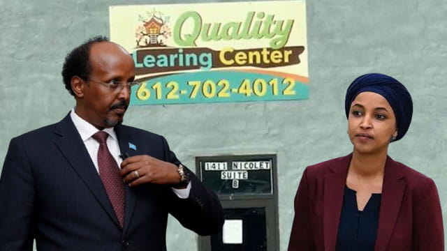 Ilhan Omar wearing Islamic clothing standing next to Somali man in front of Quality Learing Center.
