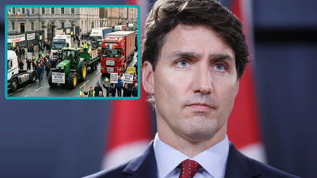 Justin Trudeau standing in front of an image of the Irish trucker protest.