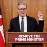 UK Prime Minister Keir Starmer giving a speech behind a podium.