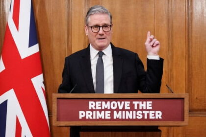 UK Prime Minister Keir Starmer giving a speech behind a podium.