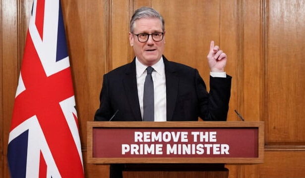 UK Prime Minister Keir Starmer giving a speech behind a podium.