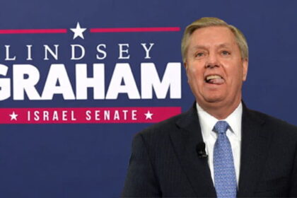 Lindsey Graham wearing a suit standing in front of a campaign sign with the words "Israel Senate."
