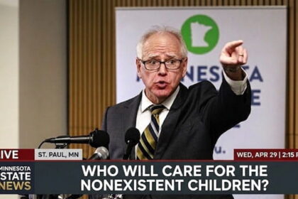 Tim Walz giving a speech behind podium on FBI raids on Somali daycare centers.