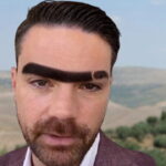 Ben Shapiro in Israel with very large eyebrows.