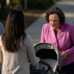 California Democrat Katie Porter looking down at a baby stroller and yelling.